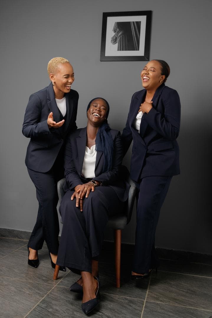 Sadia, Fatmata, and Jenabu at the firm