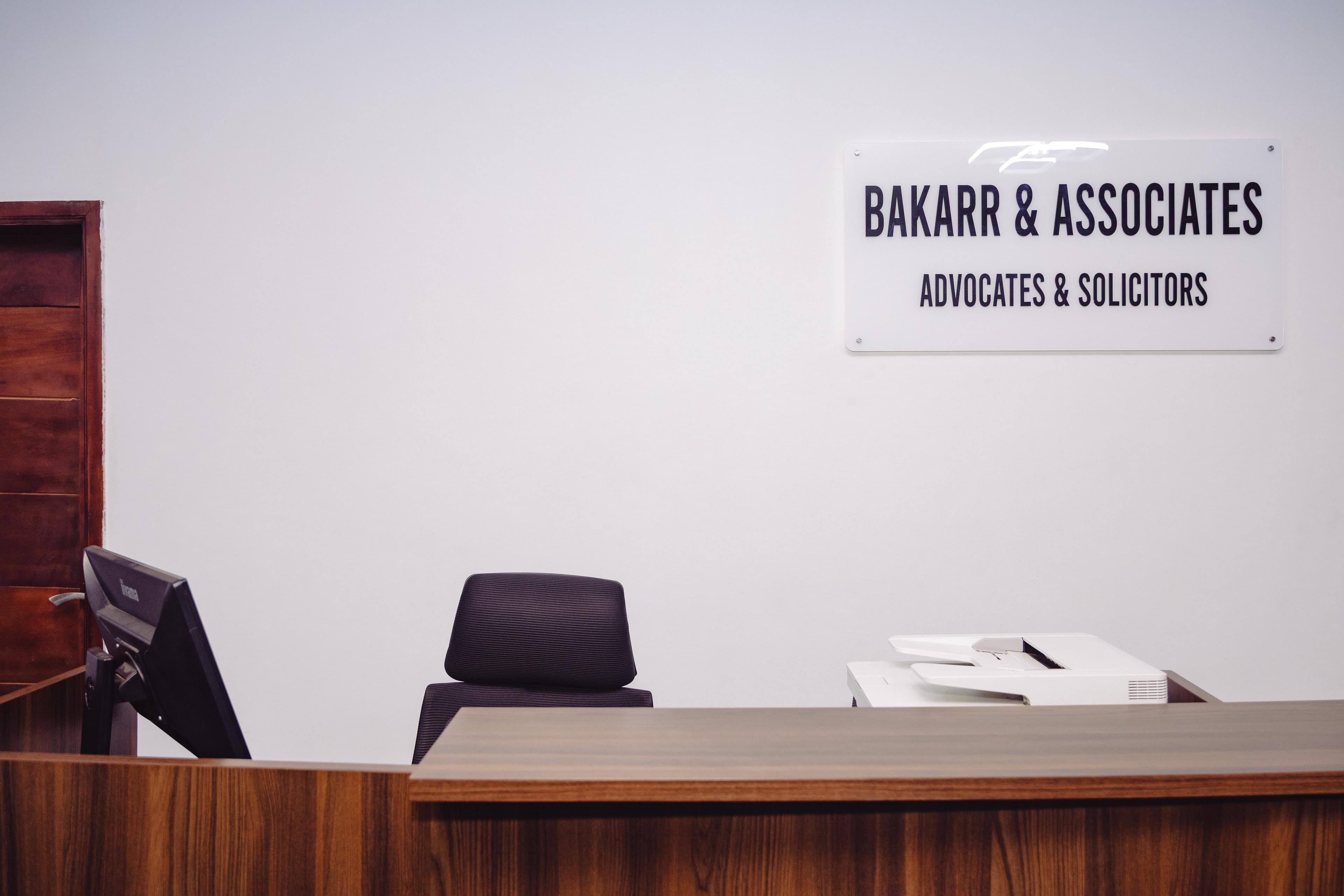 Bakarr & Associates reception with firm signage